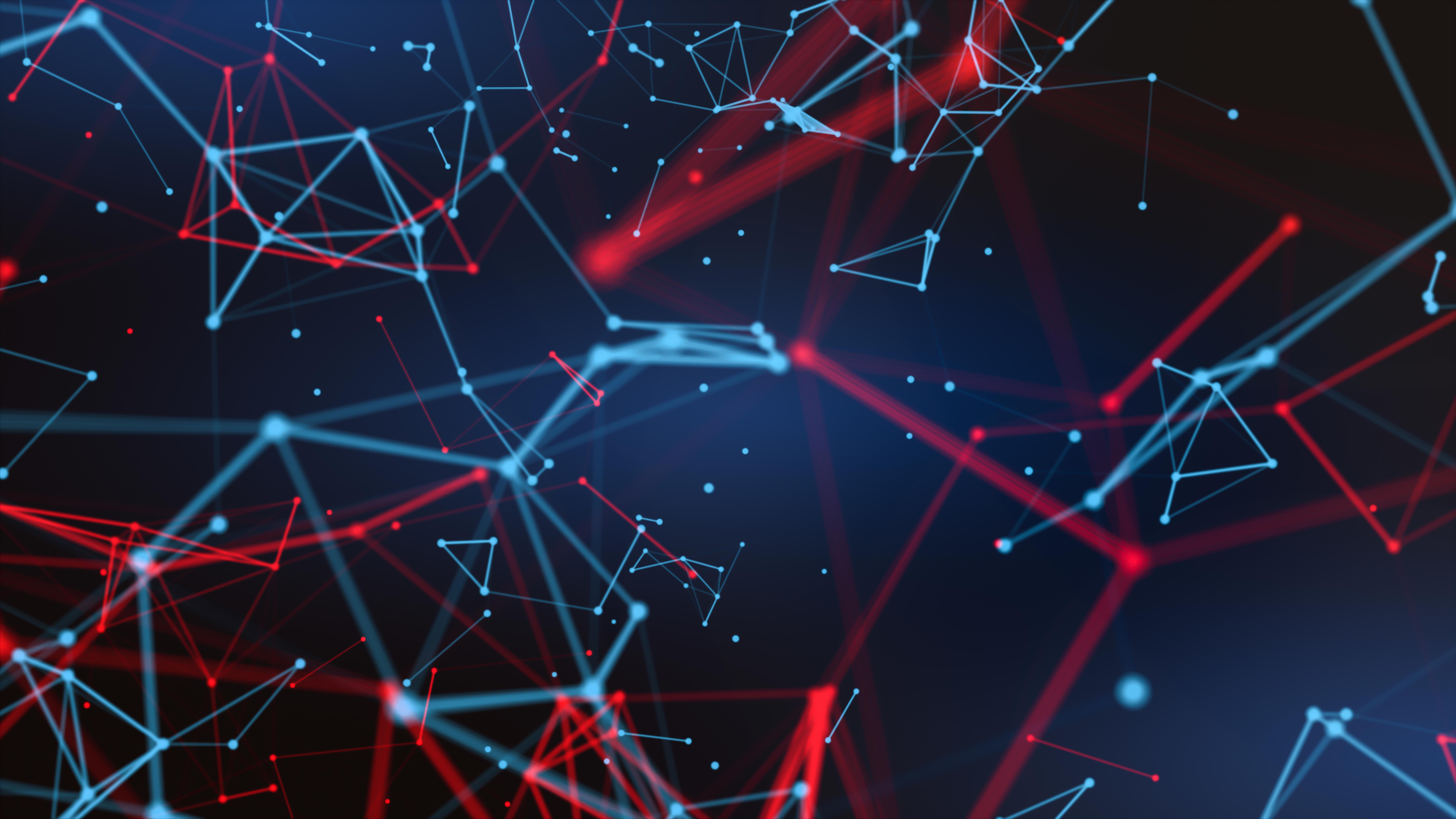 Abstract image featuring a network of interconnected red and blue lines and nodes on a dark background, representing digital connections or cybersecurity concepts