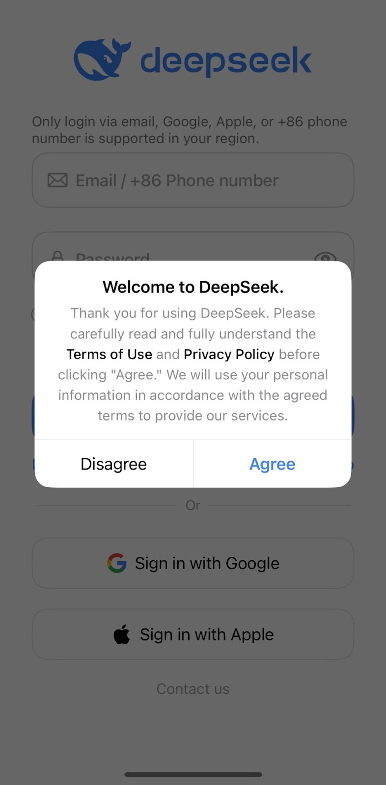 A screenshot of the DeepSeek iOS application screen that includes the DeepSeek logo at the top. A dialog box is on the screen welcoming the user to DeepSeek and instructing the user to carefully read the Terms of Use and Privacy Policy before agreeing to use the mobile application.