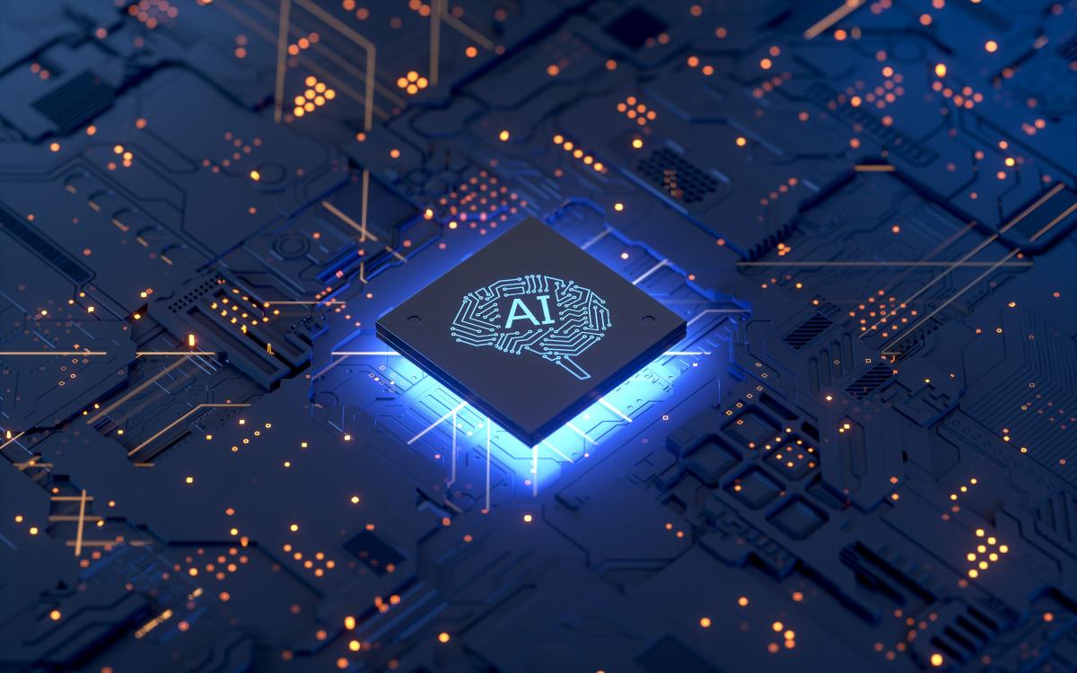 Computer motherboard with a square chip at its center labeled AI